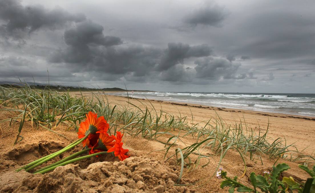 A posy of flowers on Corrimal Beach where Eliachim Muteba died in January. Picture: KIRK GILMOUR