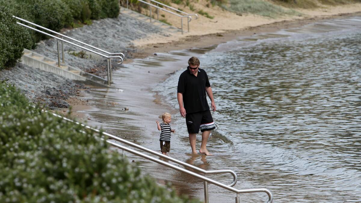 Images of the king tide at Belmore Basin on Thursday morning. Picture: GREG TOTMAN