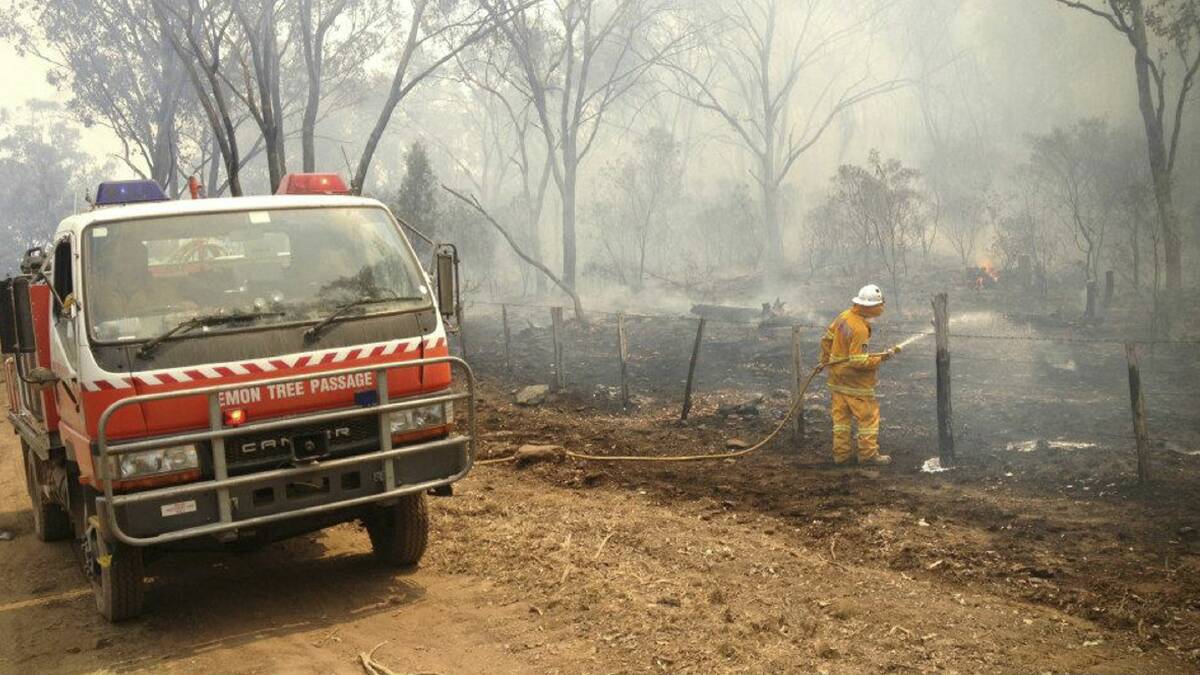 A firefighter works on a bushfire near Coonabarabran. Picture: REUTERS