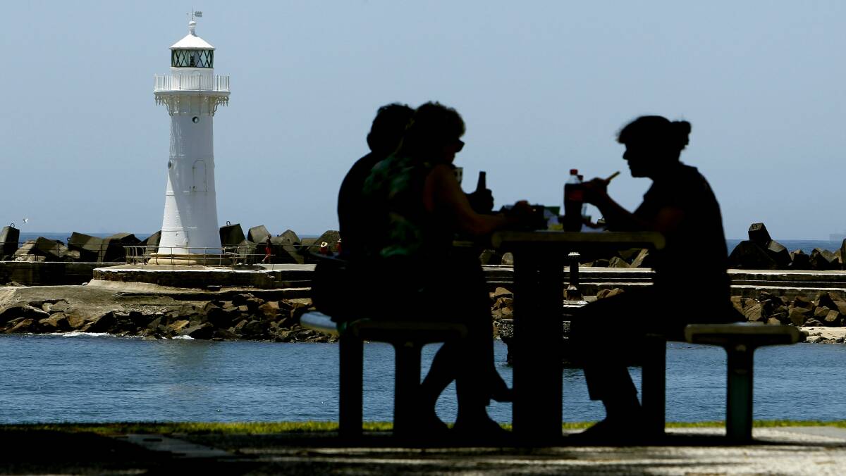 A family has lunch at Wollongong Harbour.