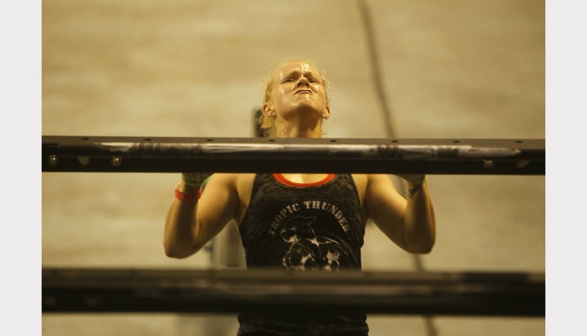  A female contestant shows the strain in the regional leg of the CrossFit Games at WIN Entertainment Centre yesterday. 