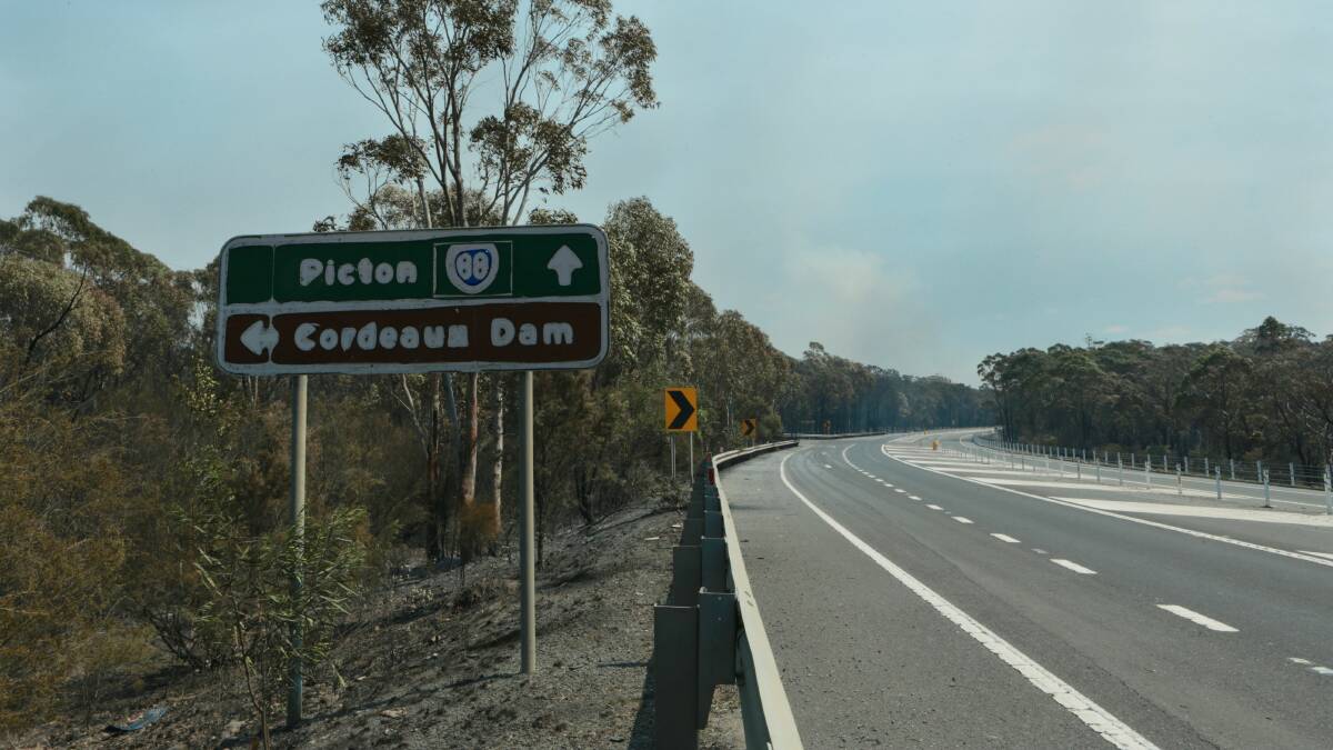 Damage to a road sign near Cordeaux Dam on Picton Road. Picture: ADAM McLEAN