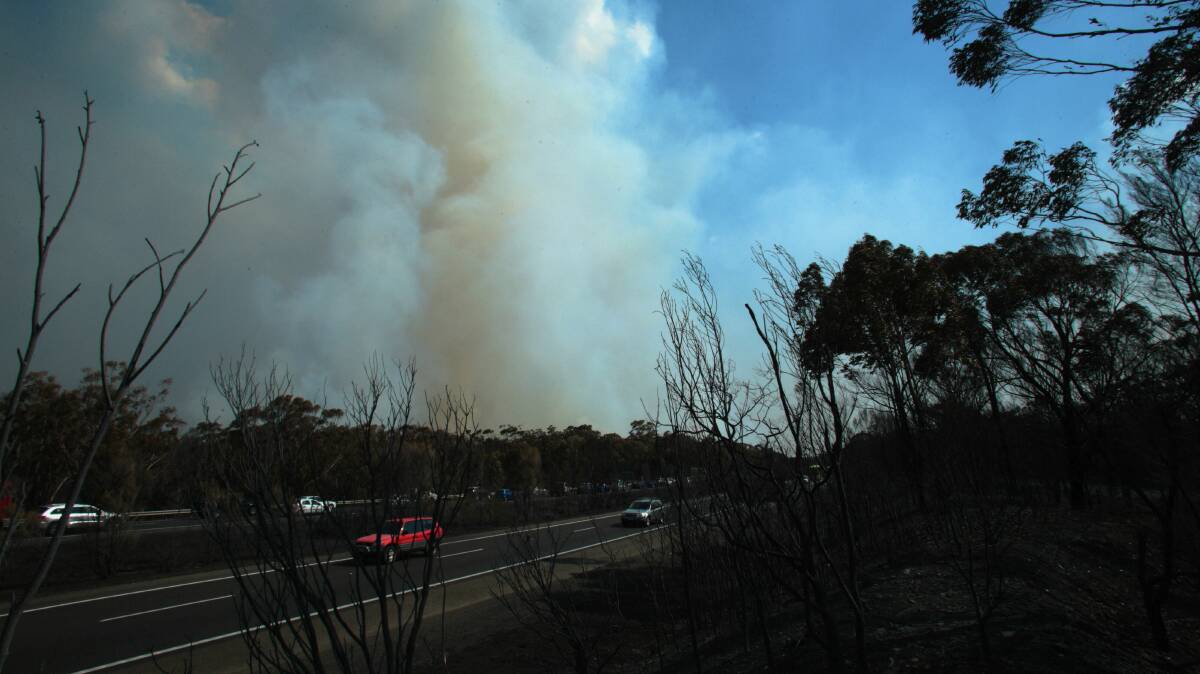 Smoke over the Hume Highway near Bargo. Picture: ADAM McLEAN