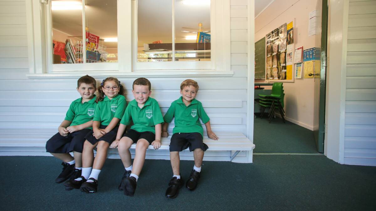 Elijah, Marley, Samuel and Bryson in their new uniforms at Primbee Public School. Picture: ADAM McLEAN