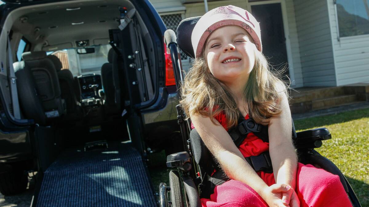 Chloe in her wheelchair beside the specially converted van. Pictures: CHRISTOPHER CHAN