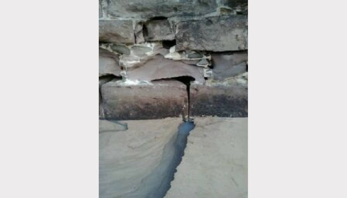 The sewage streaming out of a sandstone wall in Wollongong Harbour. Picture supplied.