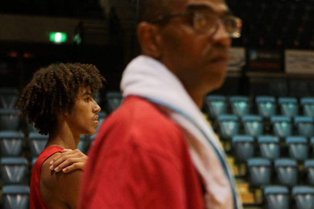 Xavier Cooks, seen here at training with father Eric (foreground), is off to the Australian Institute of Sport on Monday. Picture: ADAM McLEAN