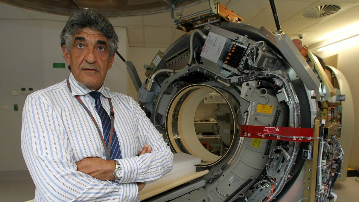 Professor Barry Elison in front of the PET scanner. Picture: GREG TOTMAN
