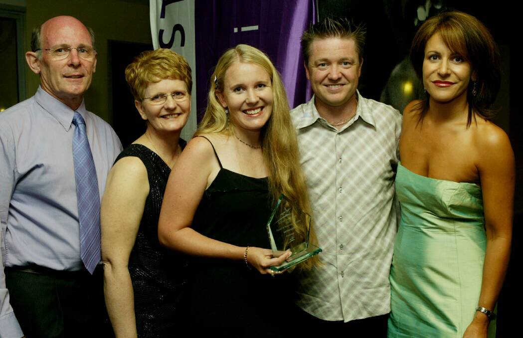 Novotel Northbeach's conference sales director Marie Georgeou presented the Footwear Award to Arthur Devenish, Wendy Devenish, Rachel Magennis and Brett Magennis of The Athletes Foot at the 2003 Crown Street Mall Retail Awards.