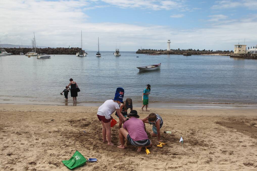 Fun in the sand at Belmore Basin. Picture: CHRISTOPHER CHAN