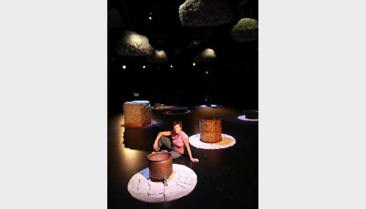 Kim Williams sits within her Under a Cloud multimedia installation. Picture: ORLANDO CHIODO