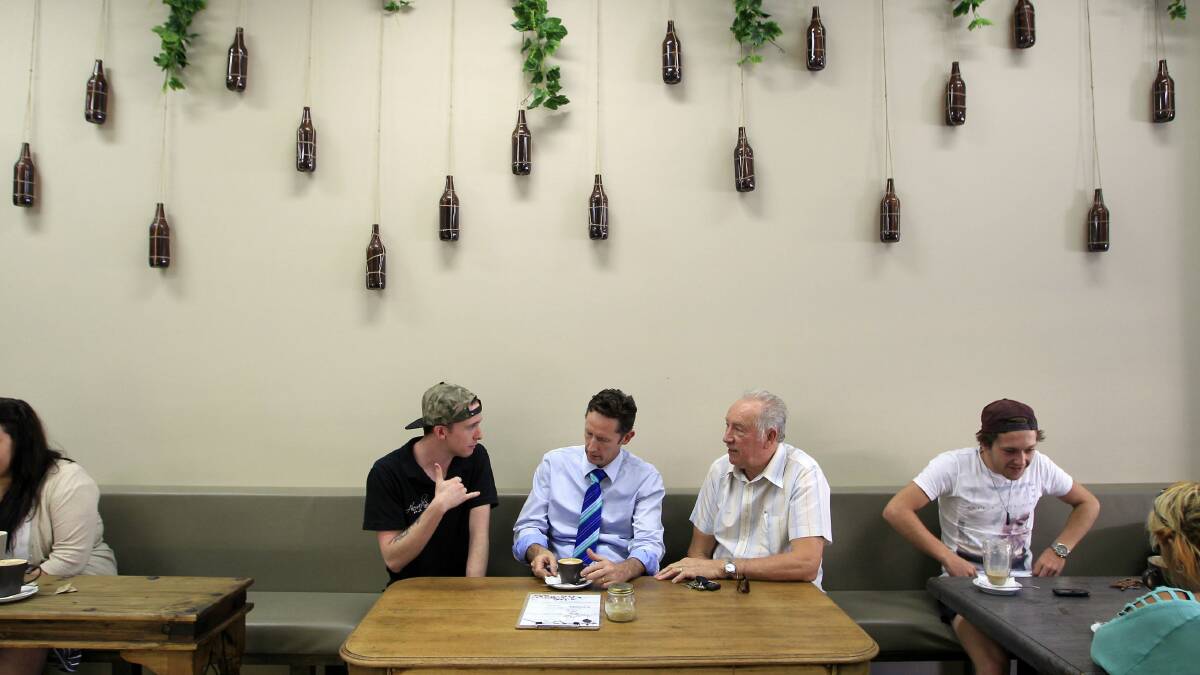Alexander’s Cafe owner Chase Murray, Throsby MP Stephen Jones and resident Terry Stretton.  Picture: ANDY ZAKELI