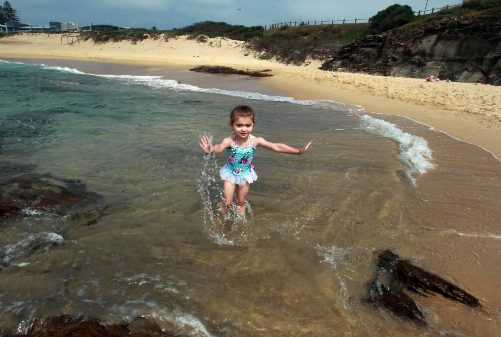 Sally, 3, splashing in the sea at City Beach.