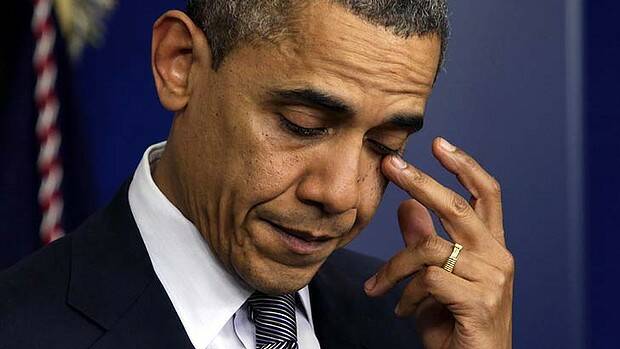 A sorrowful Barack Obama faces the media. Photo: Reuters