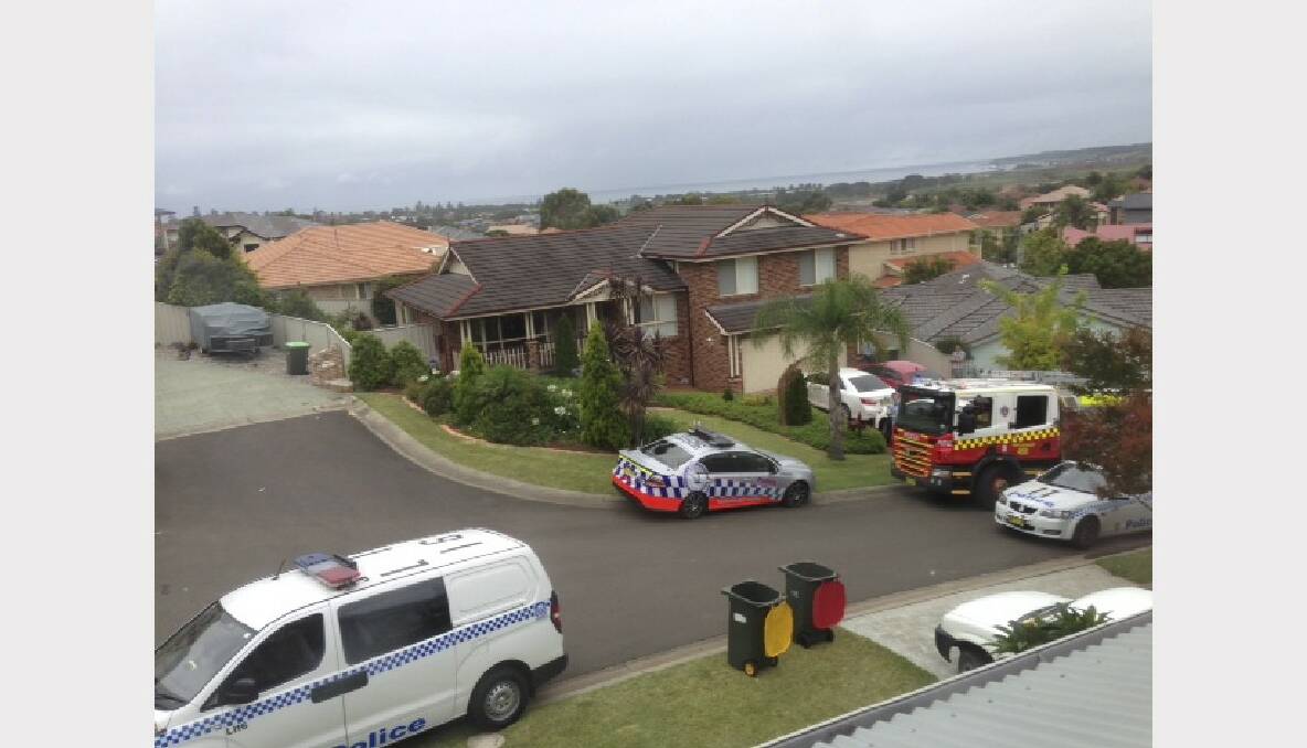 Residents of Solo Crescent, Shell Cove, watched as emergency service workers filled their street on Christmas morning.