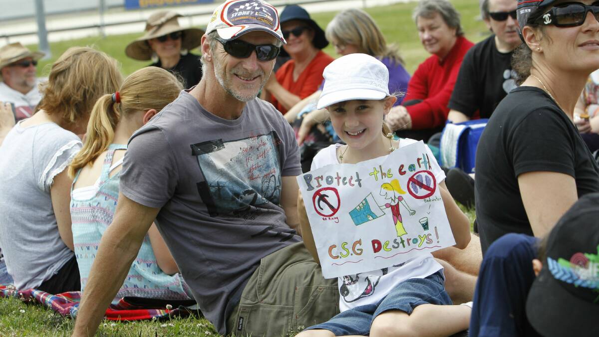 Father and daughter Chris Duffus and Ella at a Stop CSG Illawarra protest in October last year.