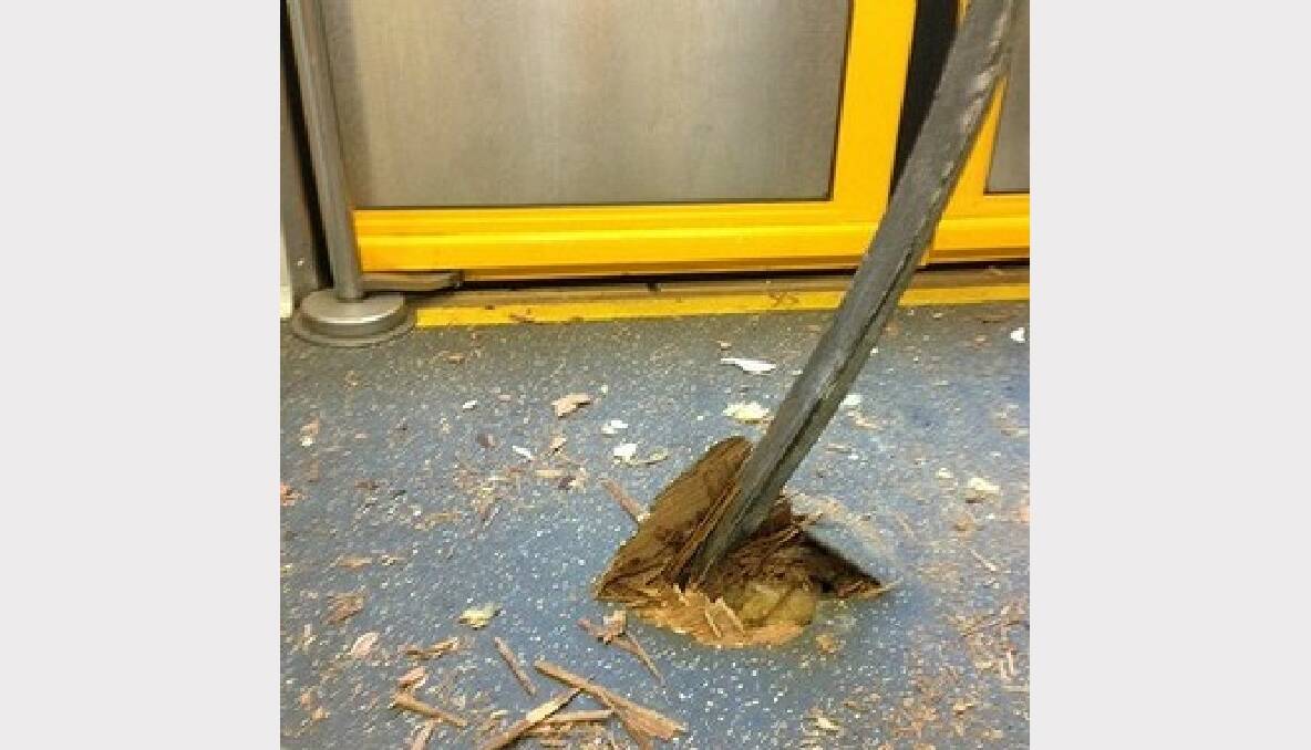 A metal pole sticks through the carriage floor. Photo: Annie Dang