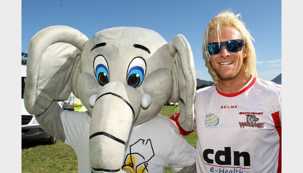 A Memory Walk mascot with Wolves footballer Steve Hayes.