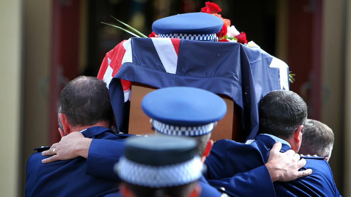 Loved ones, officers and members of the cycling community pay their last respects to Chief Inspector Graeme Donnelly. 