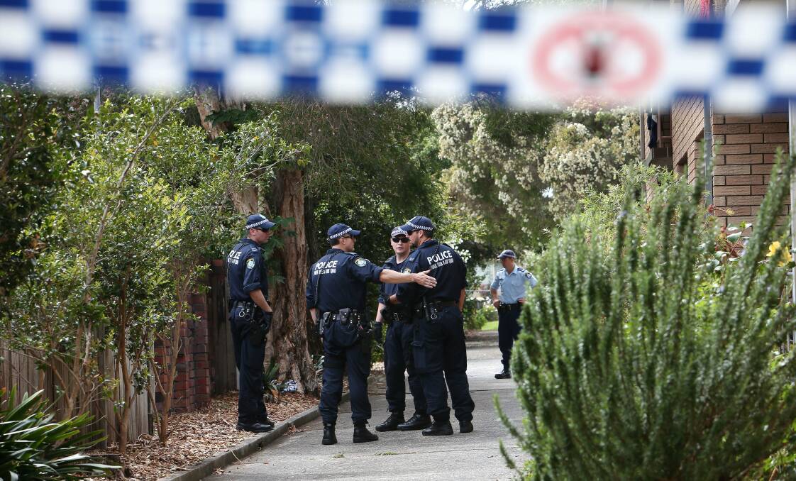 Police prepare to search the scene where a man died after being stopped by plain-clothes officers. Picture: KIRK GILMOUR