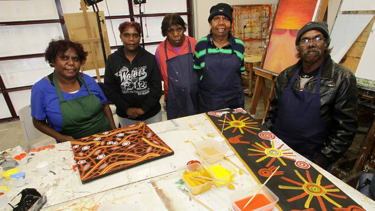 Western Desert traditional artists take part in the artist-in-residence program at the University of Wollongong. Picture: GREG TOTMAN