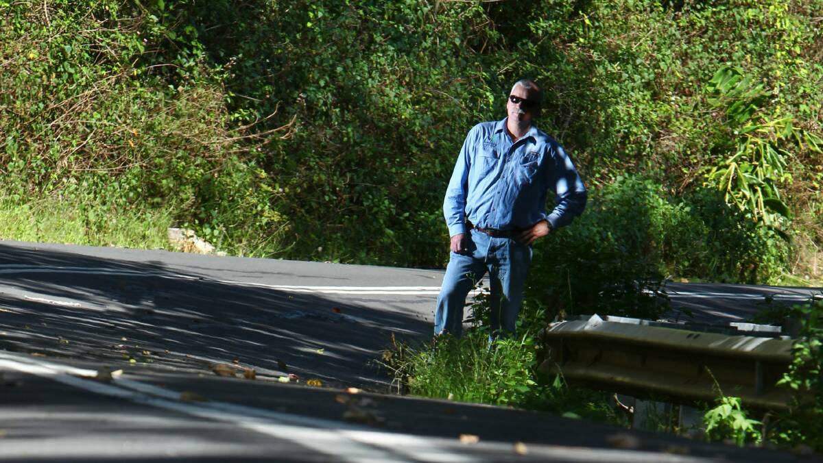 Terry Roberts stands on the affected road. Picture: KEN ROBERTSON