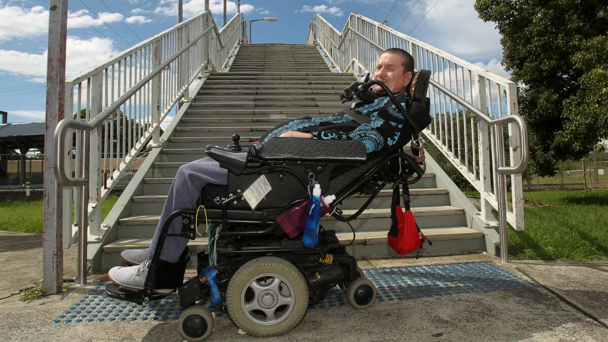 Richard Kramer at Unanderra station which has no lift access for disabled people. Picture: GREG TOTMAN