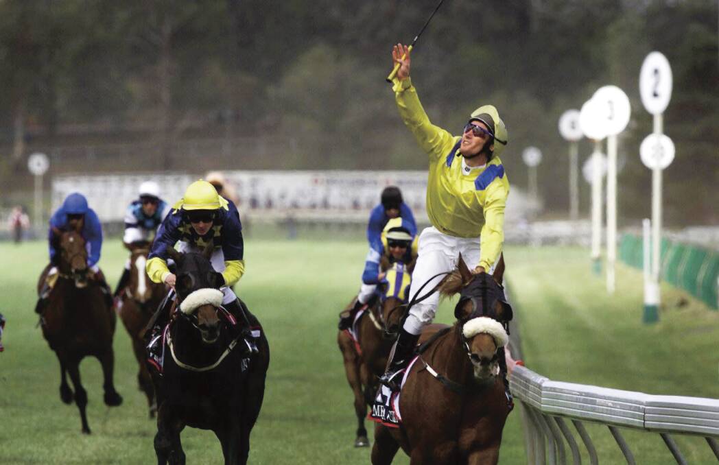 Oliver rides Media Puzzle to win a Melbourne Cup win in 2002. Picture: Angela Wylie