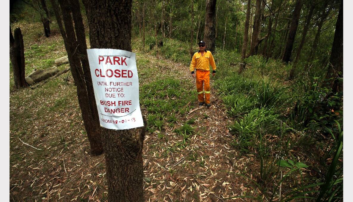 RFS volunteer Anthony Turner checks a closed walking trail in the Royal National Park.