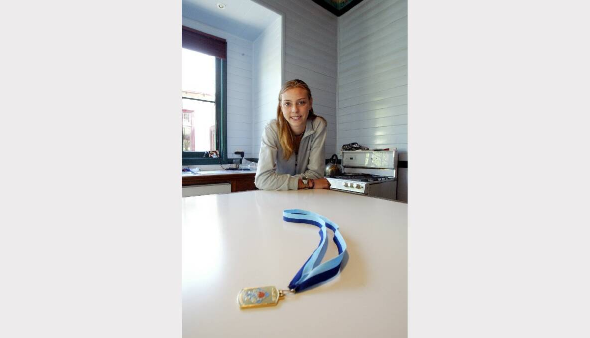 Bulli High jumper Petrina Price relaxing at home after achieving an Olympic B qualifying jump of 1.92m.