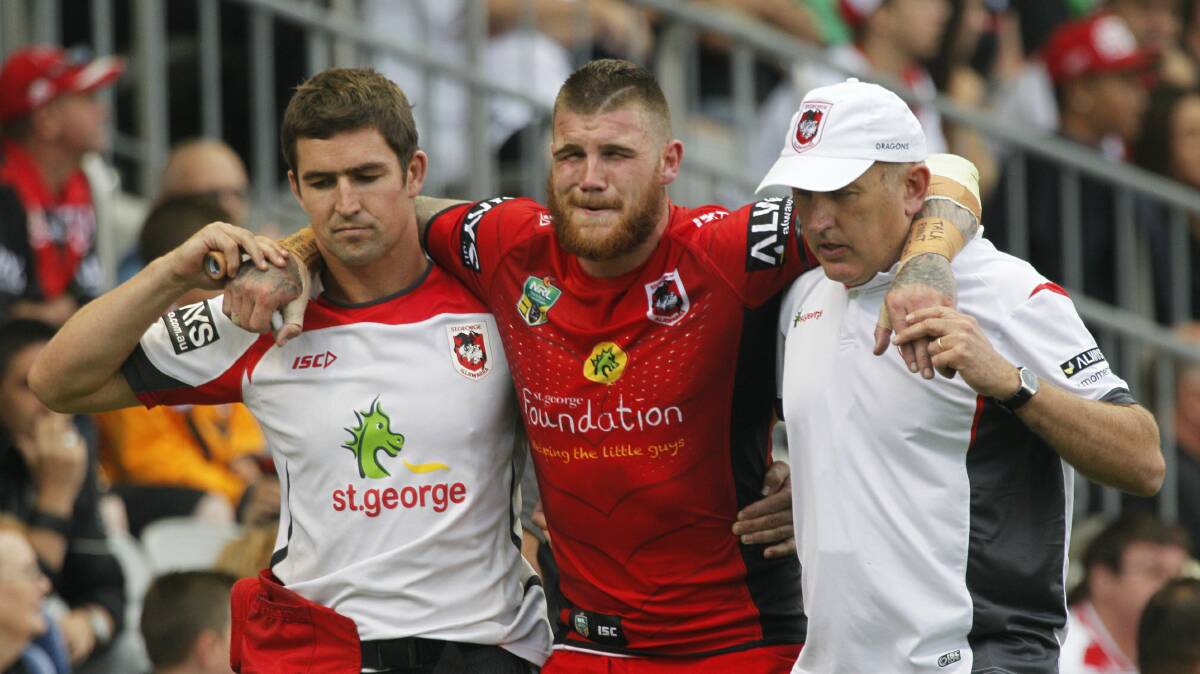 Dragons player Josh Dugan is carried off the field in the second half. Picture: CHRISTOPHER CHAN