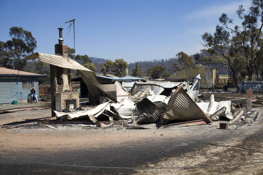 Burnt houses at Dunalley on the east coast of Tasmania after a bushfire ravaged the town. Picture: Peter Mathew