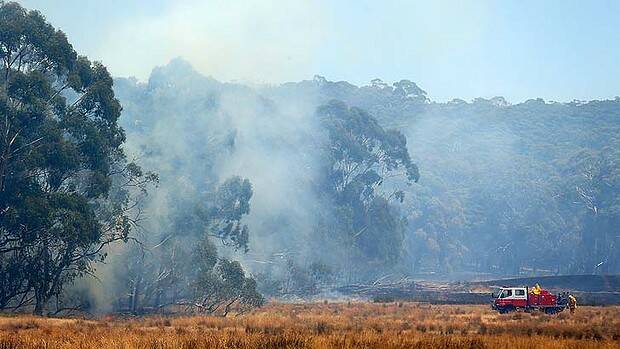Fires smoulder in Bungendore, New South Wales. Photo: Getty Images