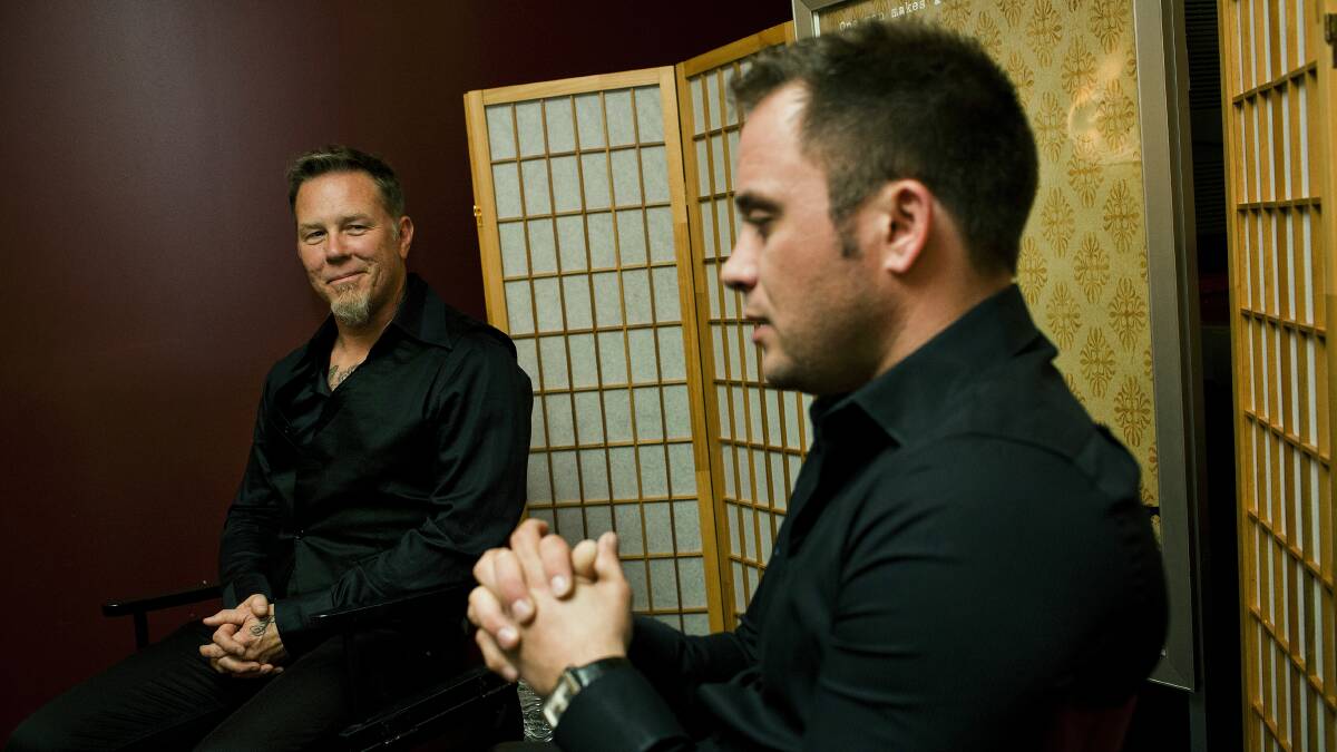 Director Justin Hunt (right) speaks with Metallica frontman James Hetfield in Absent, a documentary about the role of fathers.
