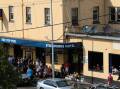  People gathered at the Port Kembla Steelworks Hotel as they waited for the stack’s demolition. Picture: ADAM McLEAN
