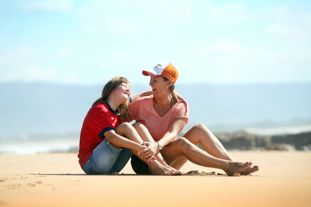 Julie Gartshore with her daughter Natalie on North Wollongong Beach. Pictures: SYLVIA LIBER