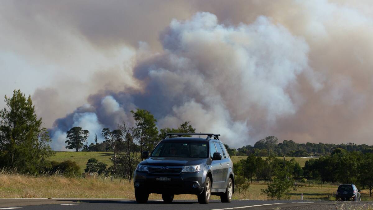 Wilton Road, with smoke from the fire zone off Picton Road in the background. Picture: ADAM McLEAN