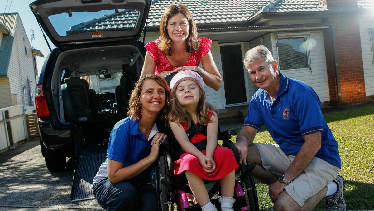 Chloe with mum Nyree, Brian Cummins from the Lions Club Austinmeer-Thirroul and Kate Russell from Northern Stars. 