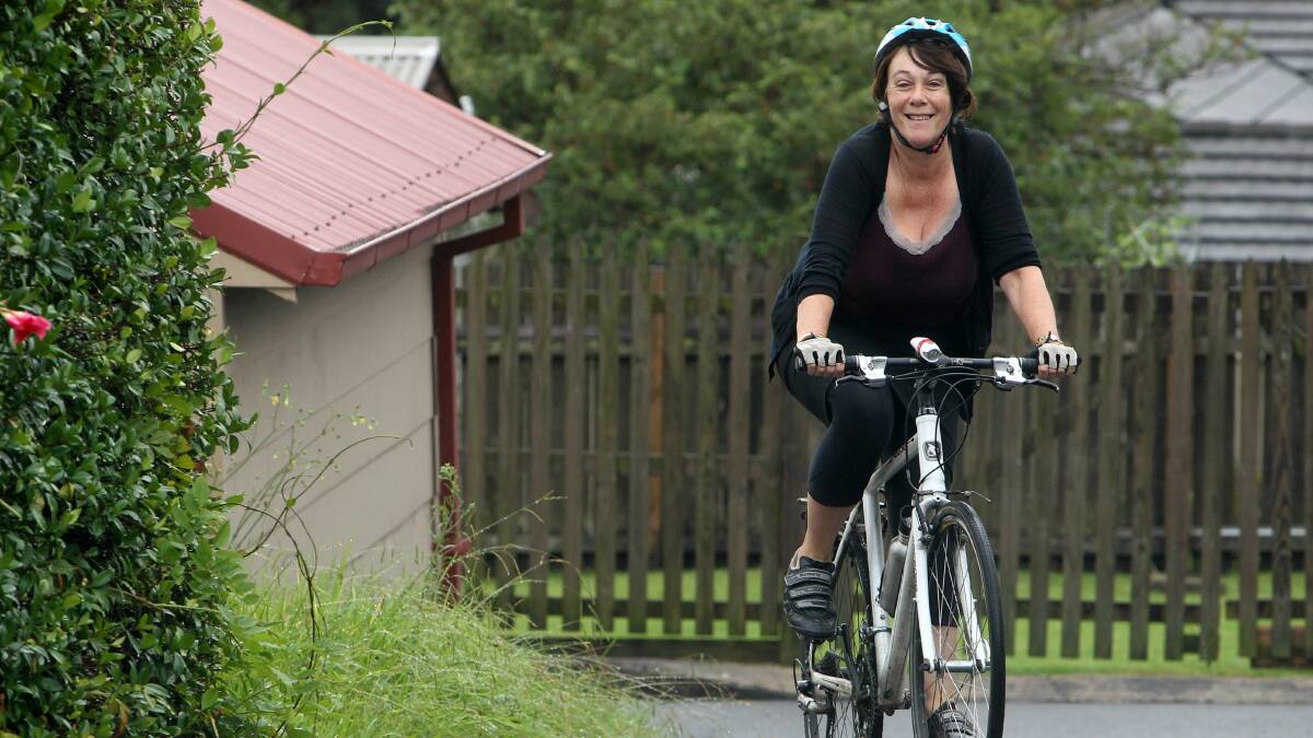 Judy Stubbs rides her bike to work in Bulli which is one of the reasons she loves Wollongong's lifestyle. Picture: GREG TOTMAN