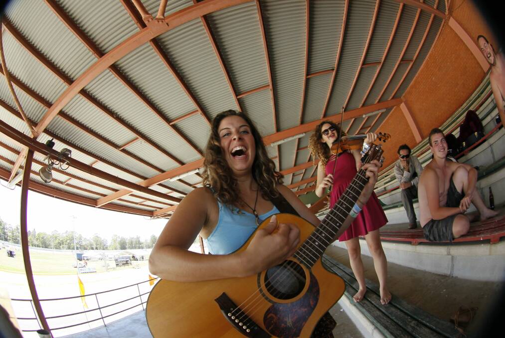 The girls from the Miss Chiefs practise in the grandstand, before the festival gets under way.