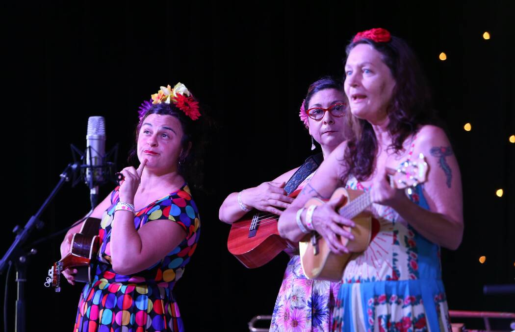Julz Strykowski, Tina Marie Sheil and Cally Darling of the Three Sisters perform at Bulli Showground. Picture: KIRK GILMOUR