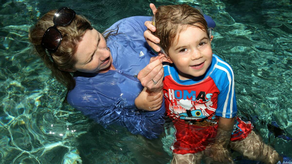 Felix tests a new device that enables him to hear in the water.