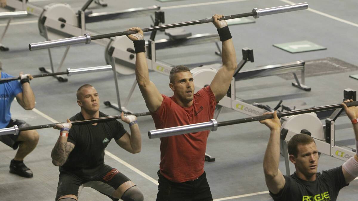 Competitor Nathan Beves of Cronulla (in red) says the CrossFit Games attracts people with a competitive edge. Pictures: DAVE TEASE