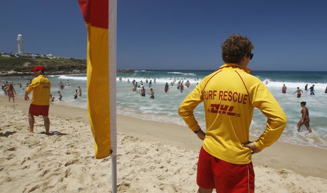 Volunteer lifeguard Noah Mowbray, 15, keeps an eye on swimmers at Wollongong City Beach.