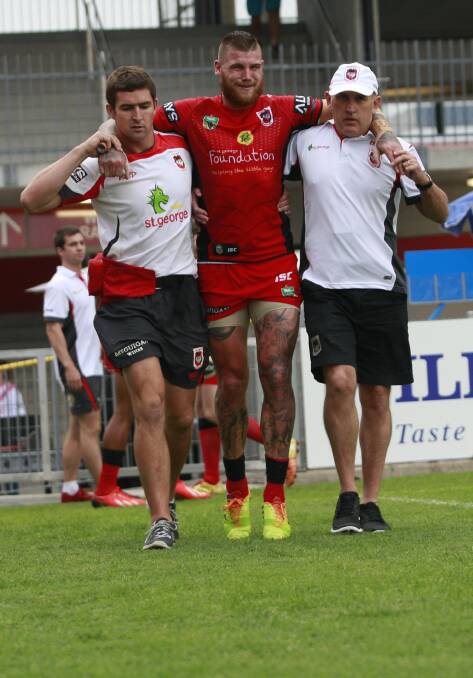 Dragons player Josh Dugan is carried off the field in the second half. Picture: CHRISTOPHER CHAN