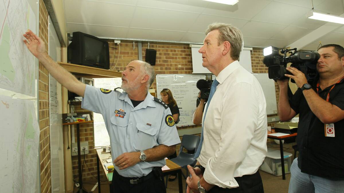 NSW Premier Barry O'Farrell with SES Incident Controller John Wall. Picture: DAVID TEASE