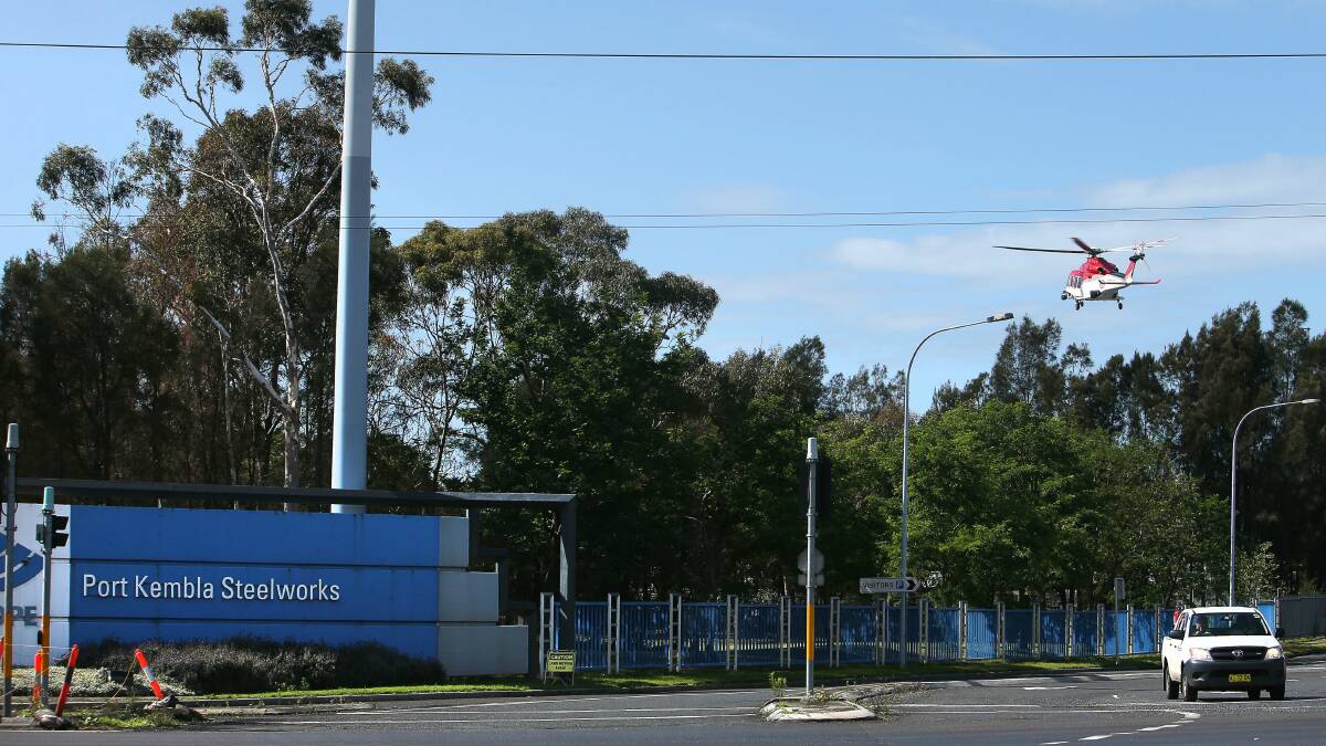 The ambulance rescue helicopter arrives at BlueScope to take a worker with a partially severed leg to hospital.