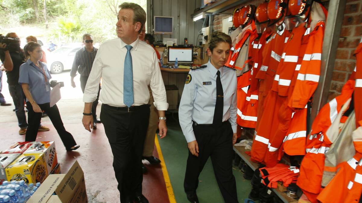 NSW Premier Barry O'Farrell and SES Deputy Commander Tara McCarthy tour the Kiama SES headquarters. Picture: DAVID TEASE