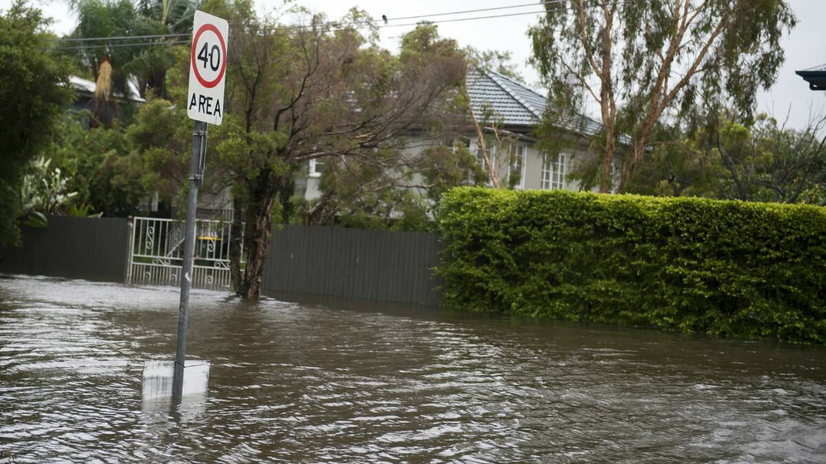 Flooding in the Brisbane suburb of Wilston today. Picture:HARRISON SARAGOSSI