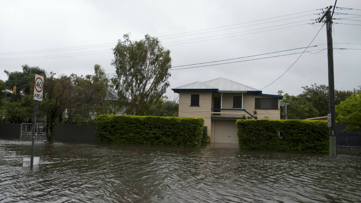Flooding in the Brisbane suburb of Wilston today. Picture:HARRISON SARAGOSSI